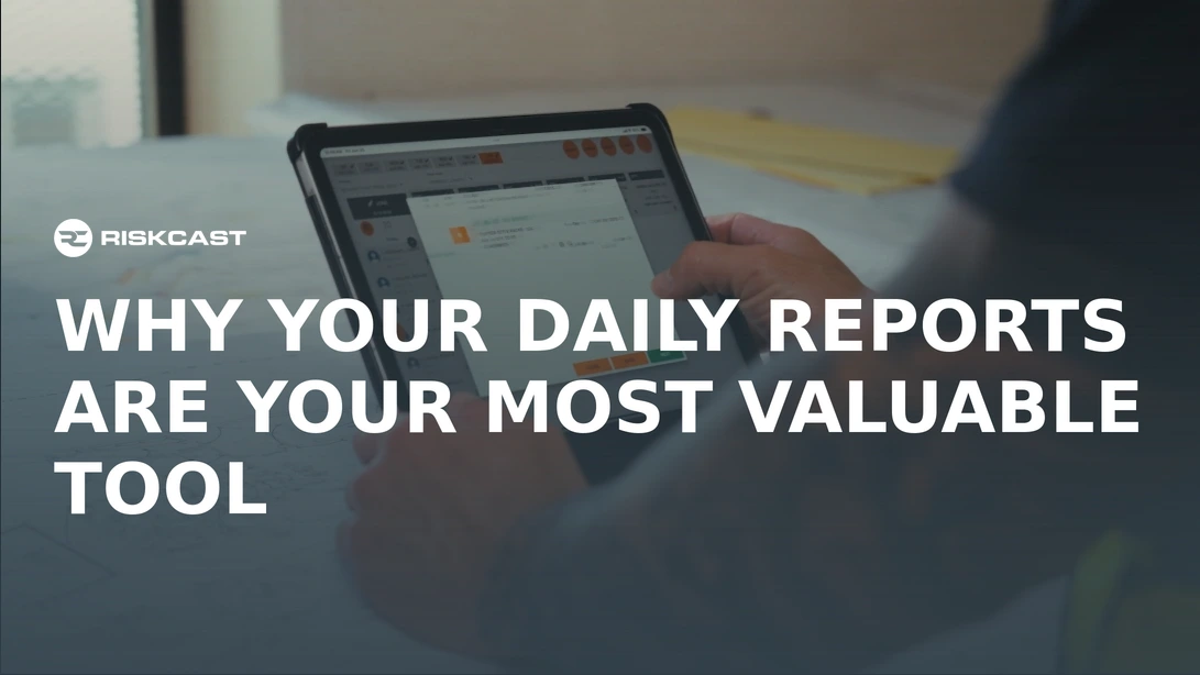 Construction foreman reviewing daily report on tablet at active heavy civil jobsite